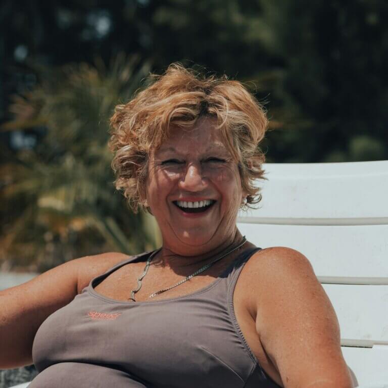 A laughing woman on a lounger