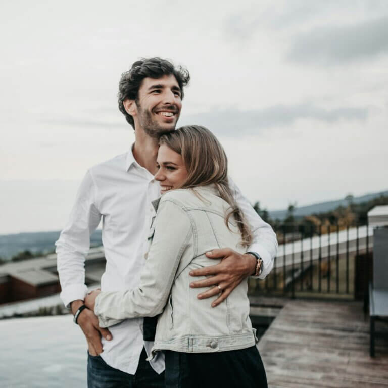 A man and a woman embrace